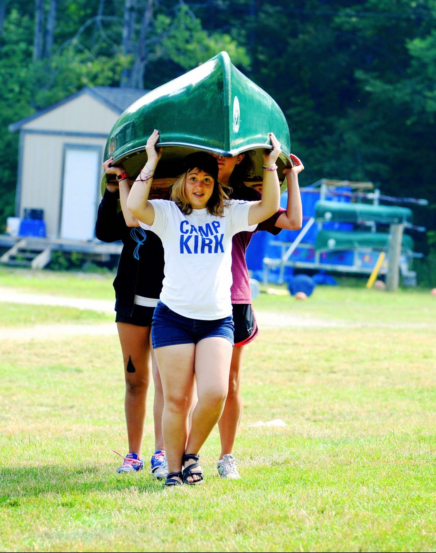 Campers portaging a canoe