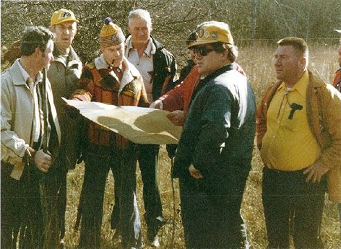 Lions Clubs members survey the site where Camp Kirk is now located