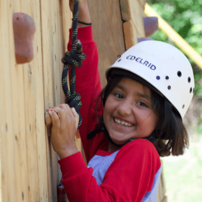 Girl with learning disability climbing the rockwall